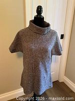 Front view of grey Columbia sweater tunic on mannequin