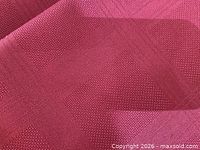 Close-up of burgundy fabric placemat weave