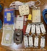 assorted outlets, plates, adapters and cords
