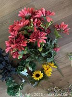 Group shot of all artificial flowers and garland on floor