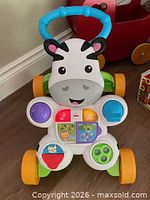 Front view of Fisher-Price zebra walker showing activity panel and wheels