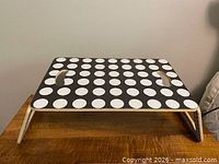 Laptop table standing on legs, side view
