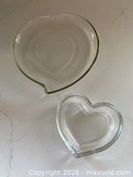 Top view of both heart-shaped clear glass plate and dish
