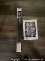 Both boxed items: InStyle LED branches and red ornament string lights