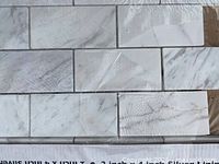 Close-up of marble brick tiles showing color and veining