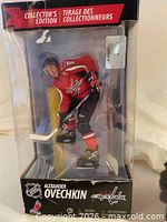 Front view of boxed Alexander Ovechkin figurine showing player pose and branding