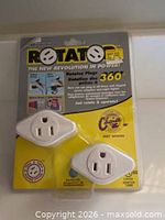 Front view of sealed package showing two white Rotator Socket adapters and branding