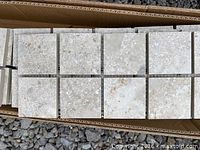 Close view of one sheet showing 2" x 2" tiles and colour variation