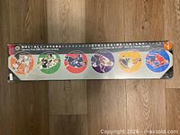 Full view of sealed wall art showing all six player images
