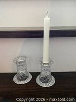 Pair of crystal candle holders with taper candle for scale