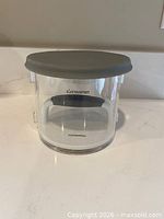 assembled patty maker with grey lid on clear body