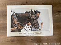 Full view of laminated print showing horse, farmer, title and artist