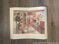 Full view of unframed poster on floor showing illustration