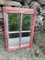 front view showing four-pane mirror and red distressed frame