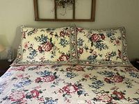 Duvet cover on bed with two pillow shams