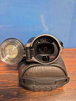 Front view showing lens, flash element, and case