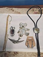 All six jewelry pieces laid out