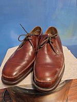 Pair of brown leather Barker derby shoes on display surface