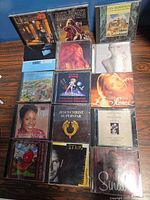 All 15 CDs laid out showing front artwork