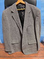 Front view of gray herringbone Protocol sport coat on hanger