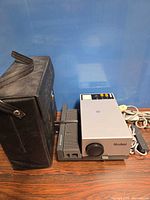 Rollei slide projector with slide tray, carry case, power cord and remote