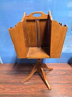 Front view showing open compartment and pedestal base