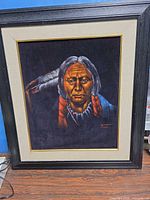 Full view of framed velvet portrait painting