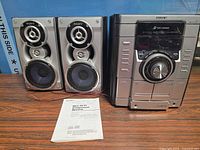 Main unit, speakers, manual visible together