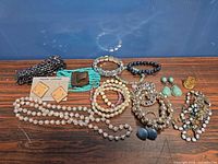 Full lot overview showing all jewelry pieces on table