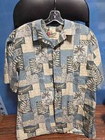 Front view of XL rayon Hawaiian shirt on hanger showing pattern and condition