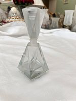 Full view of Avon faceted perfume bottle with stopper in place