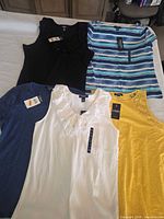 all five Chaps tops laid out showing colors and tags