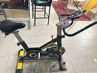 Full view of PYHIGH S2 spin bike showing frame, flywheel, seat and pedals