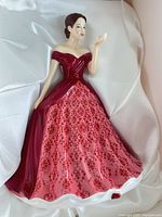 Front view of Patricia figurine inside box