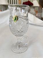 Full view of Waterford Irish coffee glass showing handle, cut pattern, pedestal foot, Waterford sticker