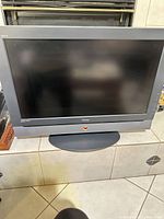 Front view of Haier 32" HDTV on stand