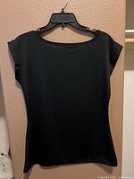 Full front view of black sleeveless top