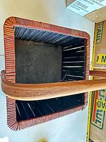 Top view of square rattan and wood basket interior