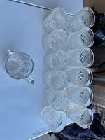 Overhead view of pitcher and twelve tumblers, confirming piece count and matching pattern