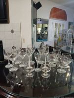 Group view of all clear glass stemware on tabletop