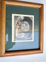 Framed print full view showing wood frame and green mat
