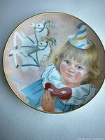 Front view of plate showing artwork and gold rim