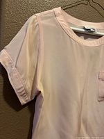 Front view showing color, neckline, sleeve, pocket