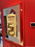 Full view of red frame mirror with attached fountain