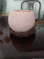 Front view of planter on twig base