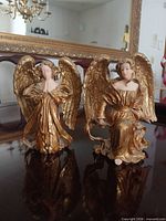 Front view of both Sansco gold porcelain angel figurines