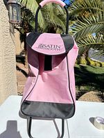 Front view of Satin Smooth pink trolley showing flap, branding and frame