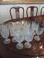 All twelve cut crystal goblets on table