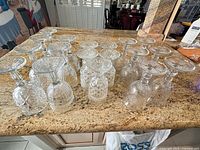 All 18 goblets upside-down showing cut starburst bases and pattern variety