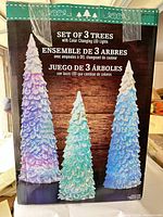 Box front showing color-changing LED Christmas trees, set of three